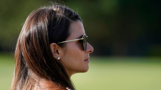 Danica Patrick watches Aaron Rodgers at the Pebble Beach Pro-Am.