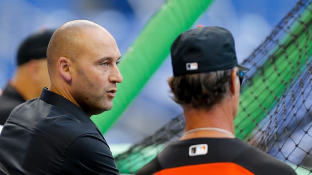 MLB's Miami Marlins part owner Derek Jeter, a former New York Yankees star, talking to Don Mattingly prior to a game.