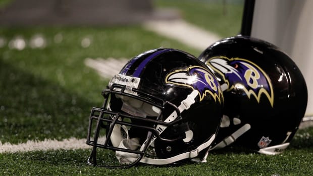 A closeup of two Baltimore Ravens football helmets.