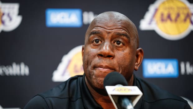 A closeup of Los Angeles Lakers great Magic Johnson addressing the media.