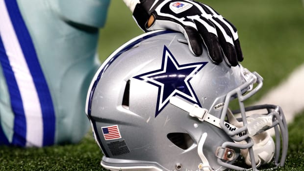 A closeup of a Dallas Cowboys football helmet.