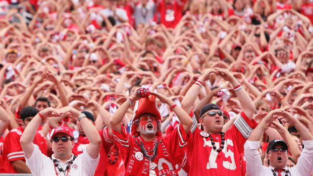 Ohio State Buckeye fans doing the "O-H-I-O" chant.