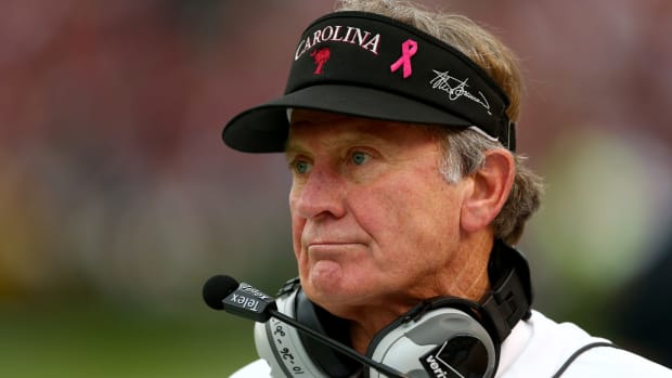 Steve Spurrier watches on during game.