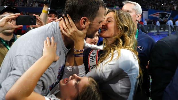 tom brady and his wife, gisele, celebrate after the super bowl