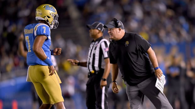 UCLA coach Chip Kelly talking to his quarterback.
