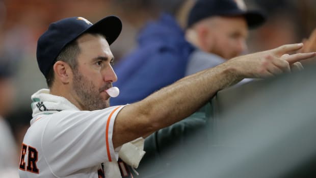 Justin Verlander blowing a bubble with his gum.