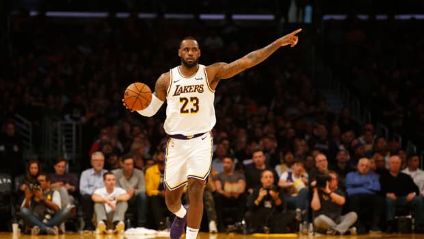 LeBron James dribbles the ball up the floor at STAPLES Center.