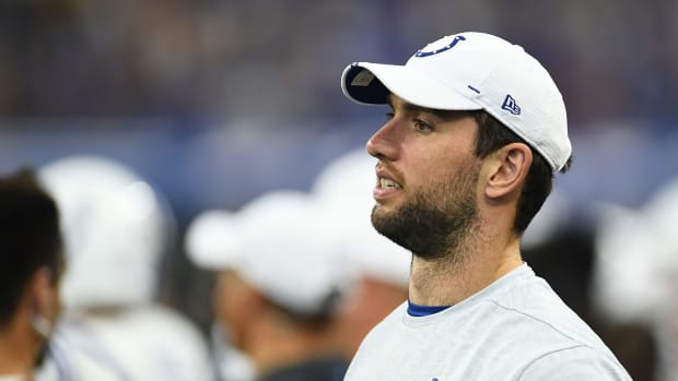 Andrew Luck stands on the sideline of the Colts game.