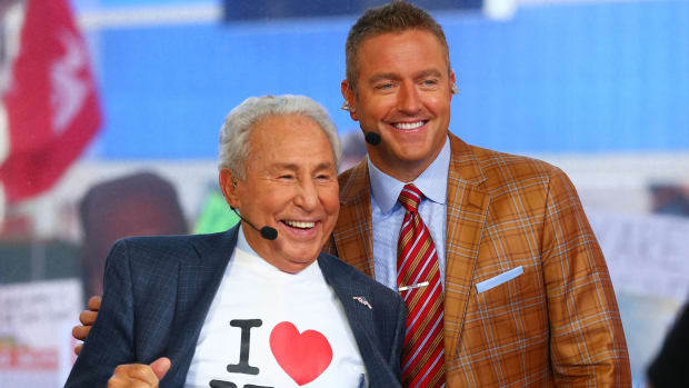 Lee Corso wearing an I Love New York T-Shirt while posing for a photo with Kirk Herbstreit.