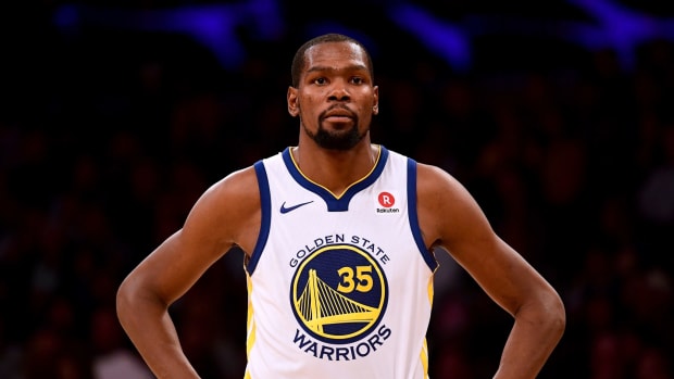 A closeup of Kevin Durant with his hands on his waste.