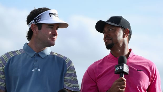 Tiger Woods and Bubba Watson share a laugh.