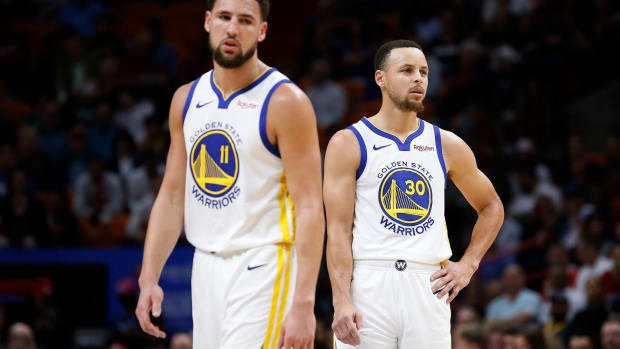 Steph Curry and Klay Thompson on the floor for the Golden State Warriors.