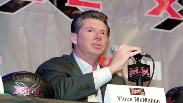 Vince McMahon speaking to the media.