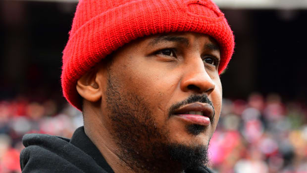 Carmelo Anthony wearing a red beanie.