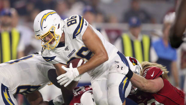 Chargers tight end Hunter Henry is tackled in a preseason game.