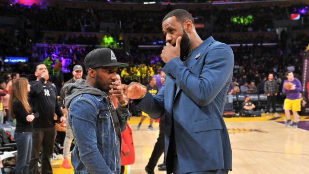 LeBron James and his agent, Rich Paul, during a game.