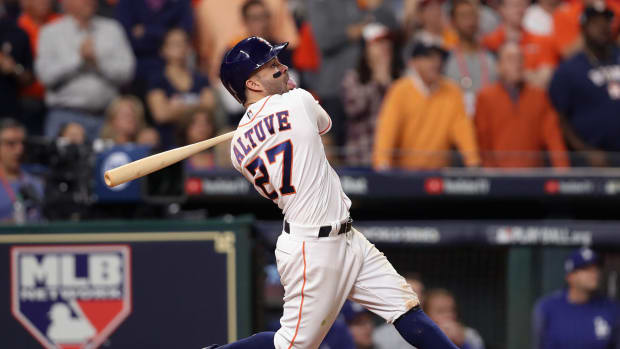 Houston Astros star Jose Altuve hits a home run in the World Series in 2017.
