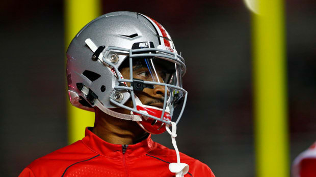 Braxton Miller wears his helmet during warm-ups at Rutgers.