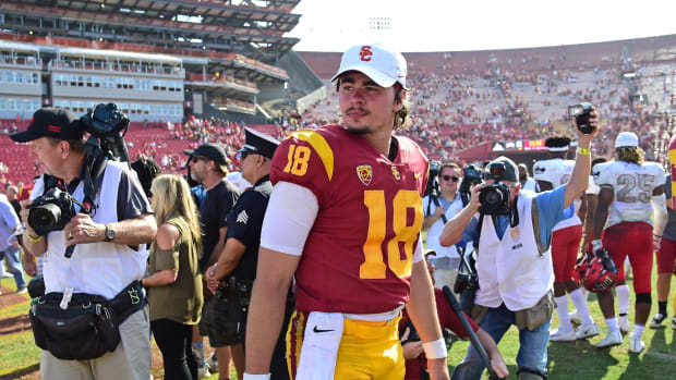 College football star JT Daniels walks off the field at USC. He is now a quarterback for the Georgia football program.
