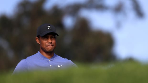 Tiger Woods competes in the first round of the Farmers Insurance Open.