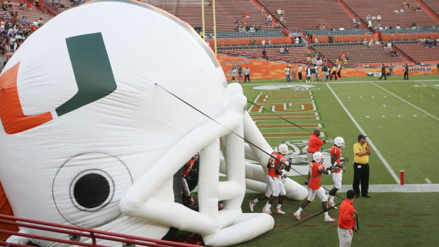 Miami players taking the field for a game.