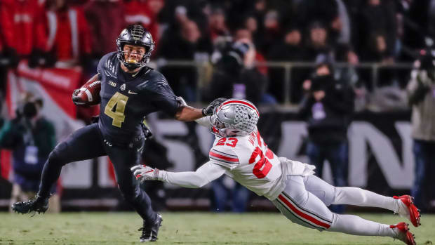 Purdue superstar Rondale Moore breaks an Ohio State tackle during a Big Ten football upset win.