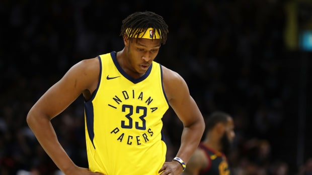 Myles Turner in a yellow Pacers uniform.
