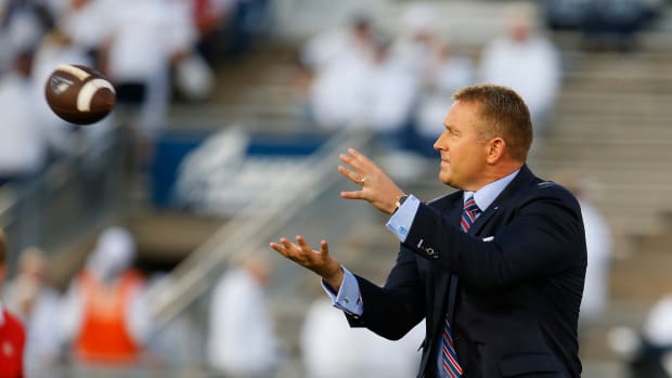 espn's Kirk Herbstreit catches a pass on the field. He recently discussed the upcoming Alabama vs. LSU game. He called his first Monday Night Football game in 2020.