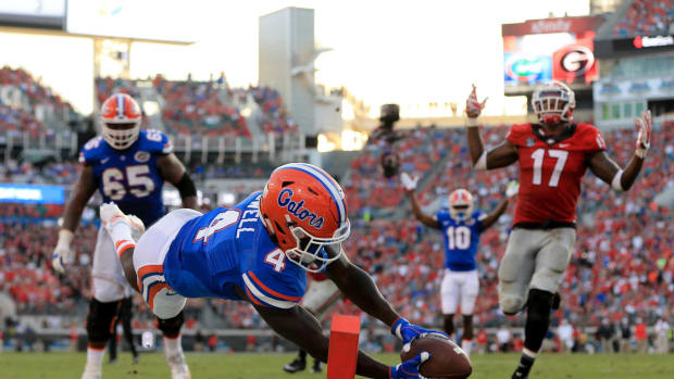 A Florida Gators player diving for the end zone against Georgia. College Football Week 10 is highlighted by this game on Saturday.