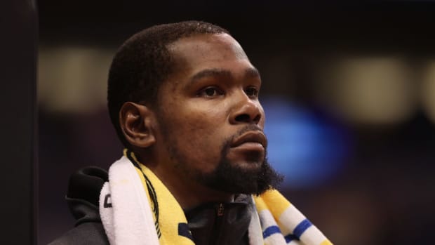 A closeup of Kevin Durant with a towel around his neck.