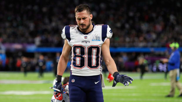 Danny Amendola walking off the field with his helmet off.