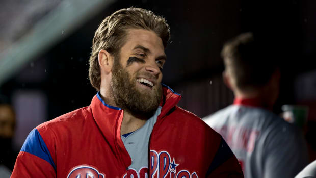 Bryce Harper laughing in the dugout.