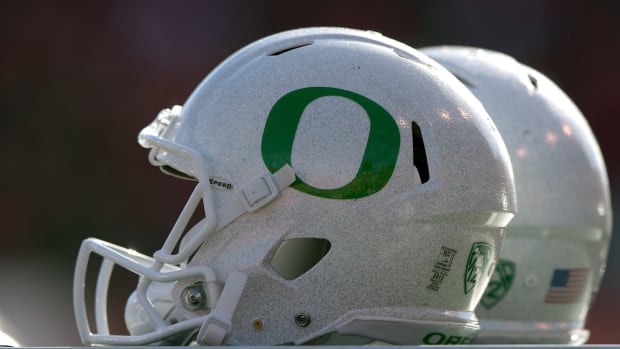 A closeup of an Oregon Ducks football helmet.