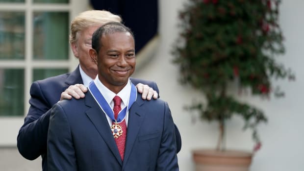 Tiger Woods receives Presidential Medal of Freedom from Donald Trump.