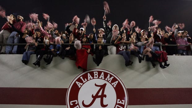 Alabama fans cheer after the Alabama Crimson Tide defeat the Auburn Tigers at Bryant-Denny Stadium.