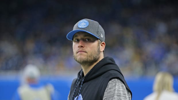 Matthew Stafford looks onto the field during a game.
