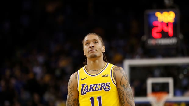 Michael Beasley walks down the court with the Lakers.