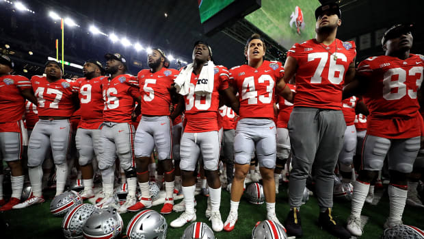 The Ohio State football team celebrating after a game.