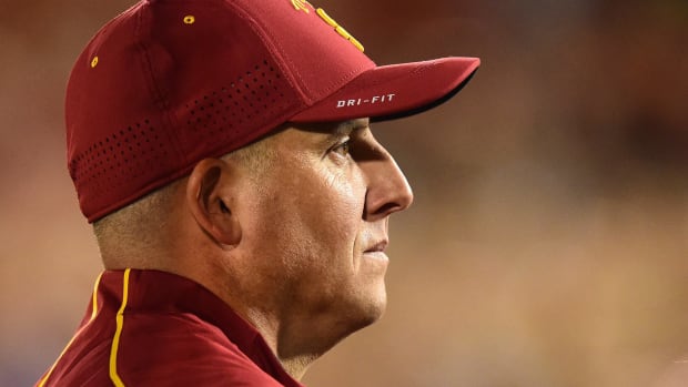 A closeup of Clay Helton in his USC football gear.