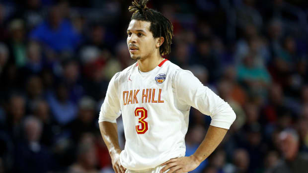 Cole Anthony of Oak Hill Academy looks on.