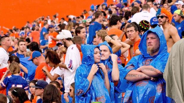 Florida Gators fans watching the game in the rain.