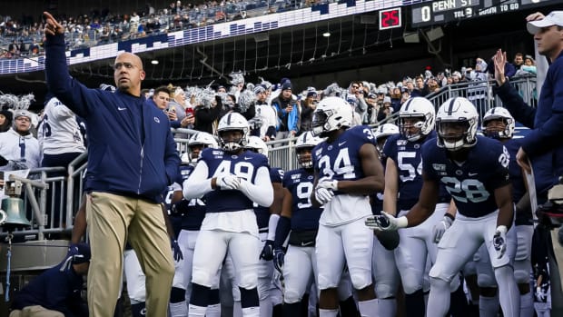 James Franklin leads Penn State out of the tunnel.