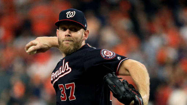Stephen Strasburg pitches in the World Series for the Nationals.