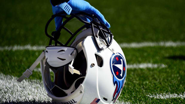 A Tennessee Titans helmet sitting on the field.