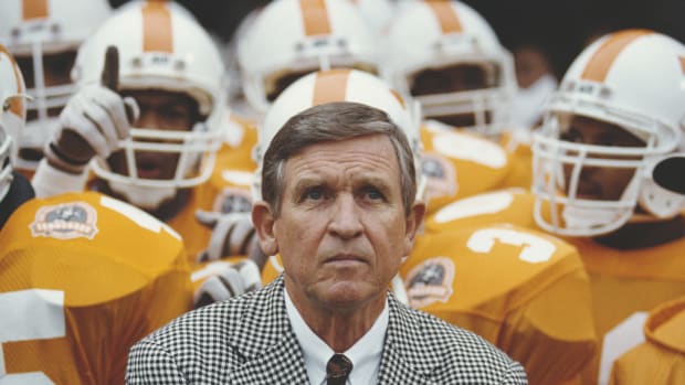 Tennessee head coach Johnny Majors leads his team onto the field.