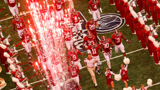 Head coach Nick Saban of the Alabama Crimson Tide takes the field with his players during the 2012 Allstate BCS National Championship Game.