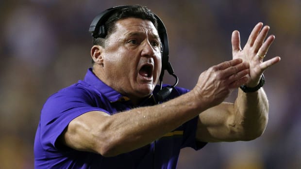 Ed Orgeron of the LSU Tigers calls a timeout during the second half of a game against the Mississippi Rebels.