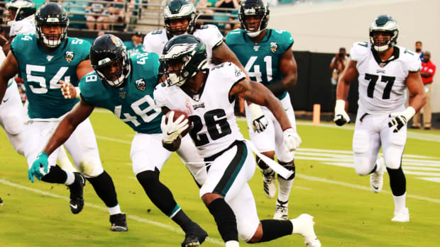 Miles Sanders carries the ball for the Philadelphia Eagles.