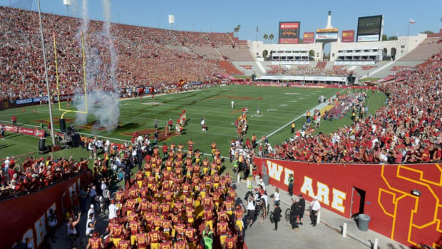 USC football players running onto the field.