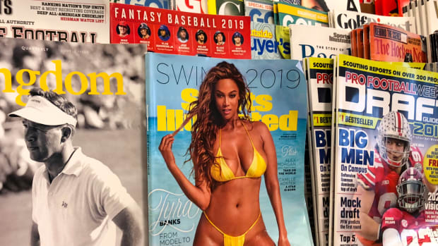 The Sports Illustrated Swimsuit Issue on a newsstand.